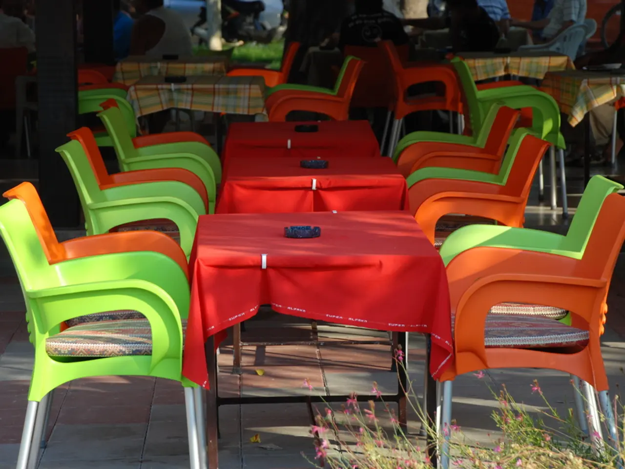 Nigella Lawson's vibrant pink garden bistro décor underscores the enduring popularity of colorful...