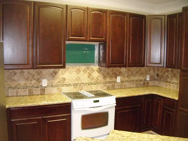 Is it advisable to install flooring beneath kitchen cabinets? Expert opinions explored