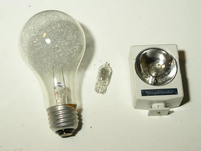 This image consists of three bulbs may be kept on the table. This image is taken may be in a room.